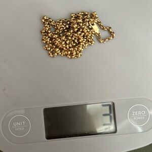 14 kt yellow gold 32 inches long .it’s really nice for a nice pendant